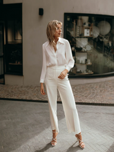 A lady wears white shirt